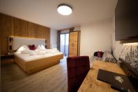 A bed or beds in a room at Felsners Hotel & Restaurant