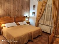 Postel nebo postele na pokoji v ubytování Casa Rural IRIS