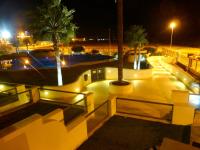 a skate park at night with palm trees and lights at Casa Valdevaqueros in Tarifa