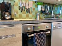 a kitchen with a stainless steel oven and a counter at Cocoon vue Mer ☆ en face du Port de Golfe-Juan ☆ in Golfe-Juan