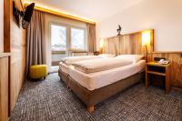 Posteľ alebo postele v izbe v ubytovaní Hotel Garni Entstrasser