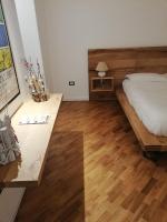A bed or beds in a room at Tito Schipa B&B