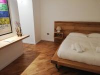 A bed or beds in a room at Tito Schipa B&B