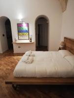 A bed or beds in a room at Tito Schipa B&B