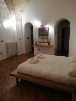A bed or beds in a room at Tito Schipa B&B