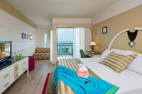 a hotel room with a bed and a television at Herods Palace Hotels & Spa Eilat a Premium collection by Fattal Hotels in Eilat
