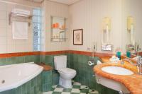 a bathroom with a tub and a toilet and a sink at Herods Palace Hotels & Spa Eilat a Premium collection by Fattal Hotels in Eilat