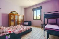 Posteľ alebo postele v izbe v ubytovaní Villa Vacanze Giuseppe