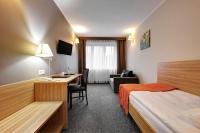 Postel nebo postele na pokoji v ubytování Hotel Leśny