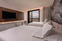 Novotel Christchurch Airportにあるベッド