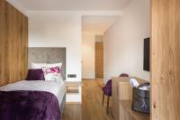 Ein Bett oder Betten in einem Zimmer der Unterkunft Boutiquehotel die Alpbacherin 4 Sterne Superior