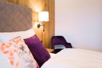 Ein Bett oder Betten in einem Zimmer der Unterkunft Boutiquehotel die Alpbacherin 4 Sterne Superior