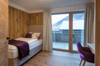 Ein Bett oder Betten in einem Zimmer der Unterkunft Boutiquehotel die Alpbacherin 4 Sterne Superior