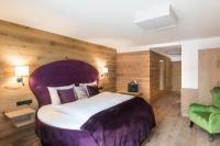 Ein Bett oder Betten in einem Zimmer der Unterkunft Boutiquehotel die Alpbacherin 4 Sterne Superior