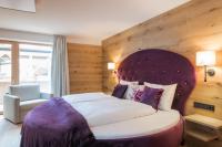 Ein Bett oder Betten in einem Zimmer der Unterkunft Boutiquehotel die Alpbacherin 4 Sterne Superior