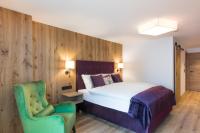 Ein Bett oder Betten in einem Zimmer der Unterkunft Boutiquehotel die Alpbacherin 4 Sterne Superior