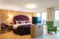 Ein Bett oder Betten in einem Zimmer der Unterkunft Boutiquehotel die Alpbacherin 4 Sterne Superior