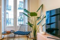 A television and/or entertainment centre at Luxury Belmont Puerta del Sol