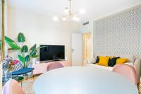 A television and/or entertainment centre at Luxury Belmont Puerta del Sol
