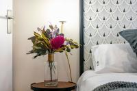 A bed or beds in a room at Luxury Belmont Puerta del Sol