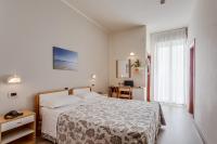 A bed or beds in a room at Hotel San Giorgio