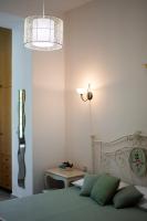 Postel nebo postele na pokoji v ubytování Aura Traditional Apartment