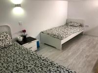 A bed or beds in a room at Cozy Apartment Malasaña FREE Parking