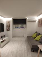 A television and/or entertainment centre at Cozy Apartment Malasaña FREE Parking