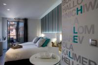 a bedroom with a white bed and a table at Salamanca Suite Studios in Salamanca