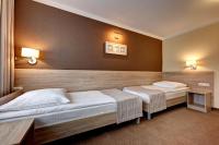 Postel nebo postele na pokoji v ubytování Hotel Leśny