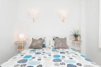 A bed or beds in a room at Apartamento Pinebeach