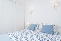 A bed or beds in a room at Apartamento Pinebeach