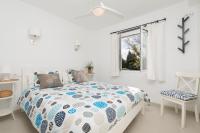 A bed or beds in a room at Apartamento Pinebeach