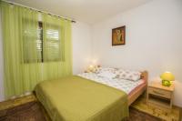 Postel nebo postele na pokoji v ubytování Apartman Laurus Malinska
