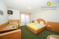 A bed or beds in a room at Pension Sonnwendhof