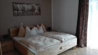 Łóżko lub łóżka w pokoju w obiekcie Ferienwohnung Wohlesser