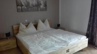Łóżko lub łóżka w pokoju w obiekcie Ferienwohnung Wohlesser