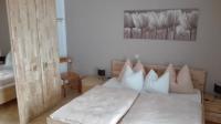 Łóżko lub łóżka w pokoju w obiekcie Ferienwohnung Wohlesser