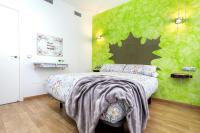 Posteľ alebo postele v izbe v ubytovaní Apartamentos Momas La Casa De Mamá