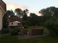 a yard with two couches in front of a house at B&amp;B Asbeek in Asse