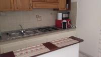 A kitchen or kitchenette at The Garden