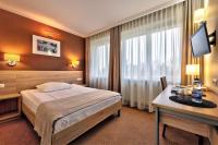 Postel nebo postele na pokoji v ubytování Hotel Leśny