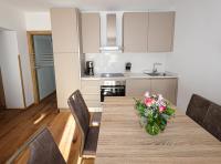 A kitchen or kitchenette at Appartementhaus Römerhof Superior - Kärnten Card Sommer inklusive