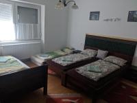 Posteľ alebo postele v izbe v ubytovaní Római Fürdő Apartmanház