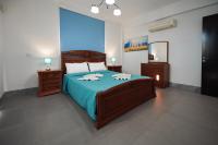 Postel nebo postele na pokoji v ubytování Beach Front Bella Vista by Ezoria Villas