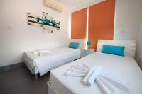 Postel nebo postele na pokoji v ubytování Beach Front Bella Vista by Ezoria Villas