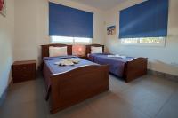 Postel nebo postele na pokoji v ubytování Beach Front Bella Vista by Ezoria Villas
