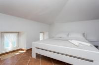 Postel nebo postele na pokoji v ubytování Apartmani Obala
