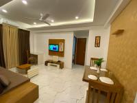 Utsavam Hotel Apartmentsにあるテレビまたはエンターテインメントセンター