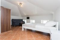 Postel nebo postele na pokoji v ubytování Apartmani Obala